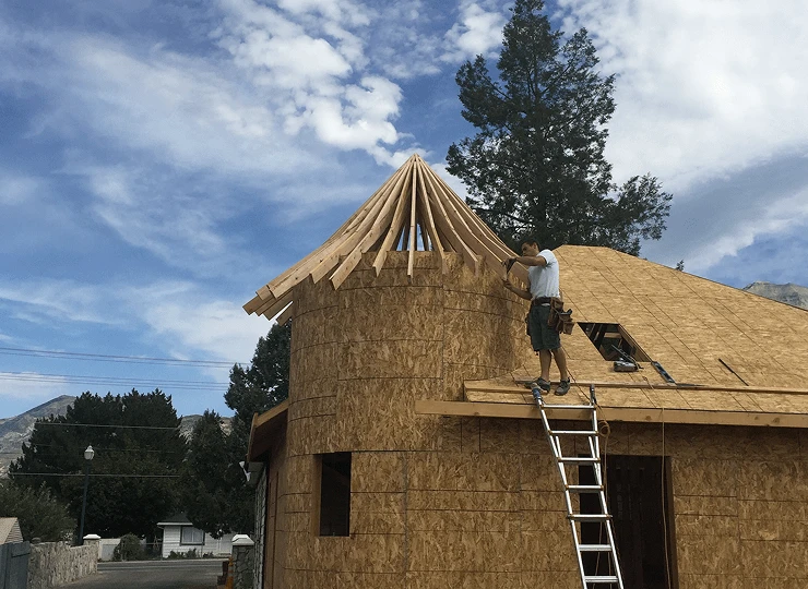 man working mid construction on a project in Utah